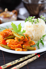 Image showing Red chicken curry stripes with rice