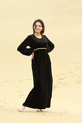 Image showing Young smiling woman in desert