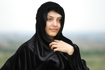 Image showing Woman in shawl looking sideways