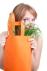 Image showing Woman hiding behind shopping bag