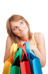 Image showing Thinking woman with colorful bags