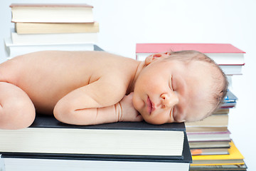 Image showing Close-up of baby sleep on the books