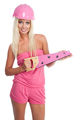 Image showing Blond woman with pink saw