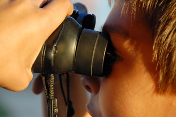 Image showing Looking through binocular