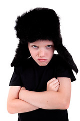 Image showing cute boy with a cap, angry, with arms crossed