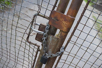 Image showing Secured gate in decay