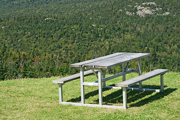 Image showing Picnic table with view over mountain forest