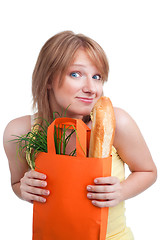 Image showing Surprised woman with baguette