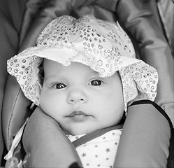 Image showing little girl in baby-seat