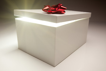 Image showing Red Bow Gift Box Lid Showing Very Bright Contents