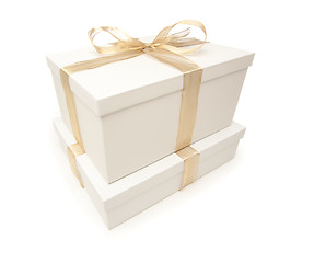 Image showing Stacked White Gift Boxes with Gold Ribbon Isolated