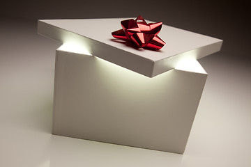 Image showing Red Bow Gift Box Lid Showing Very Bright Contents