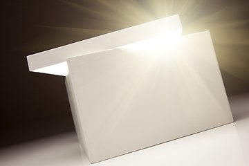 Image showing White Box with Lid Revealing Something Very Bright