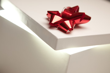 Image showing Red Bow Gift Box Lid Showing Very Bright Contents