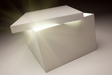 Image showing White Box with Lid Revealing Something Very Bright