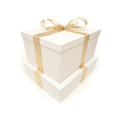 Image showing Stacked White Gift Boxes with Gold Ribbon Isolated