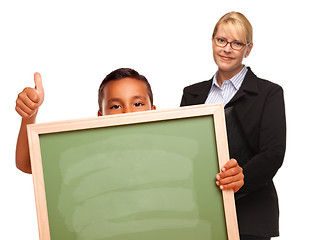 Image showing Hispanic Boy Holding Chalk Board and Female Teacher Behind