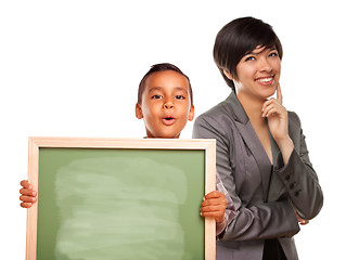 Image showing Hispanic Boy Holding Chalk Board and Female Teacher Behind