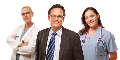 Image showing Smiling Businessman with Female Doctor and Nurse