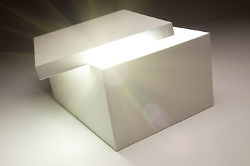 Image showing White Box with Lid Revealing Something Very Bright