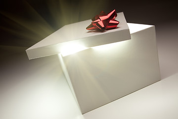 Image showing Red Bow Gift Box Lid Showing Very Bright Contents