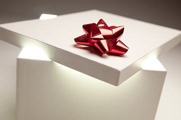 Image showing Red Bow Gift Box Lid Showing Very Bright Contents