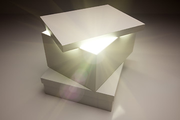Image showing White Box with Lid Revealing Something Very Bright