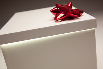 Image showing Red Bow Gift Box Lid Showing Very Bright Contents