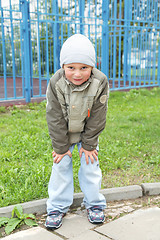 Image showing Little boy bending forward