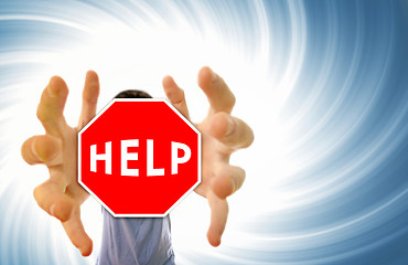 Image showing Man grabing a help sign.