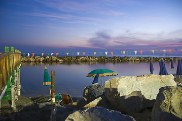 Image showing Beach Umbrellas at Sunset