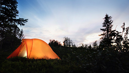 Image showing A tent lit up at dusk 