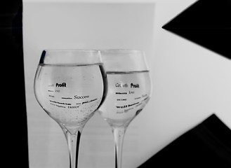 Image showing Two black-and-white glasses