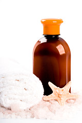 Image showing salt, towel, body lotion and seastar