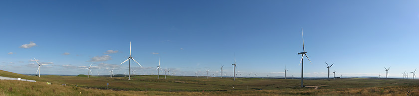 Image showing Wind farm panorama with blue sky