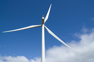 Image showing Wind turbine in blue sky with cloud