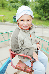 Image showing Little boy on rolling swing