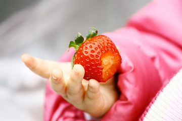 Image showing Strawberry in child hand