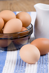 Image showing brown eggs and milk 