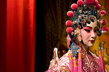 Image showing chinese opera dummy and red cloth as text space ,it is a toy,not