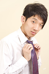 Image showing Young Asian man wearing suit