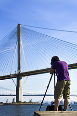 Image showing man take photo of the bridge