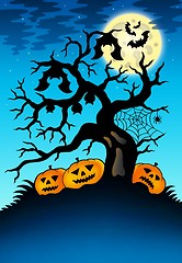 Image showing Spooky tree with bats and pumpkins