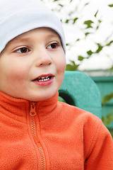 Image showing Boy in orange closeup