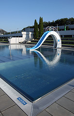 Image showing dispeopled bath pool with white slide