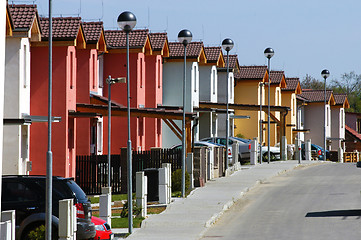 Image showing Raw ofwhite red and yellowl houses