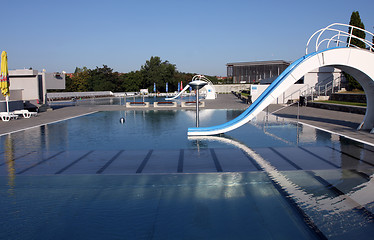 Image showing dispeopled bath pool with white slide