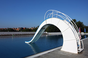 Image showing dispeopled bath pool with white slide