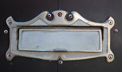 Image showing Nameplate on wooden door