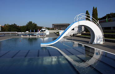 Image showing dispeopled bath pool with white slide